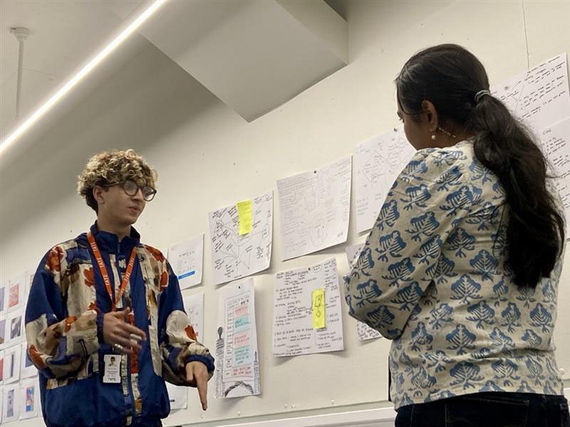 A conversation in front of the pinned ideas