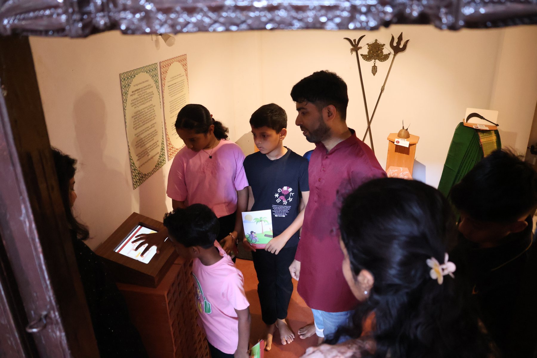 A family using the Tulu home interactive on a tablet