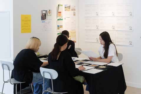 Visitors writing rice memories at the table