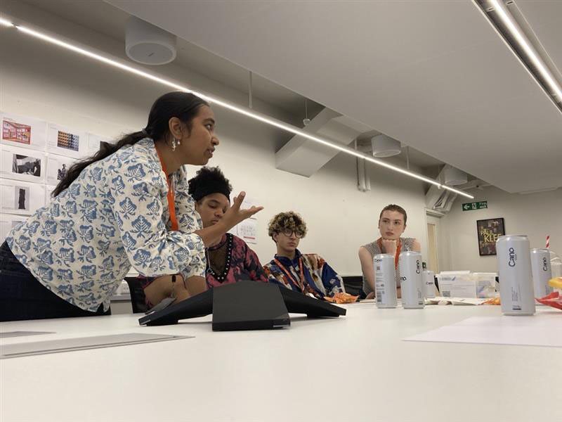 Leaning in to discuss with participants