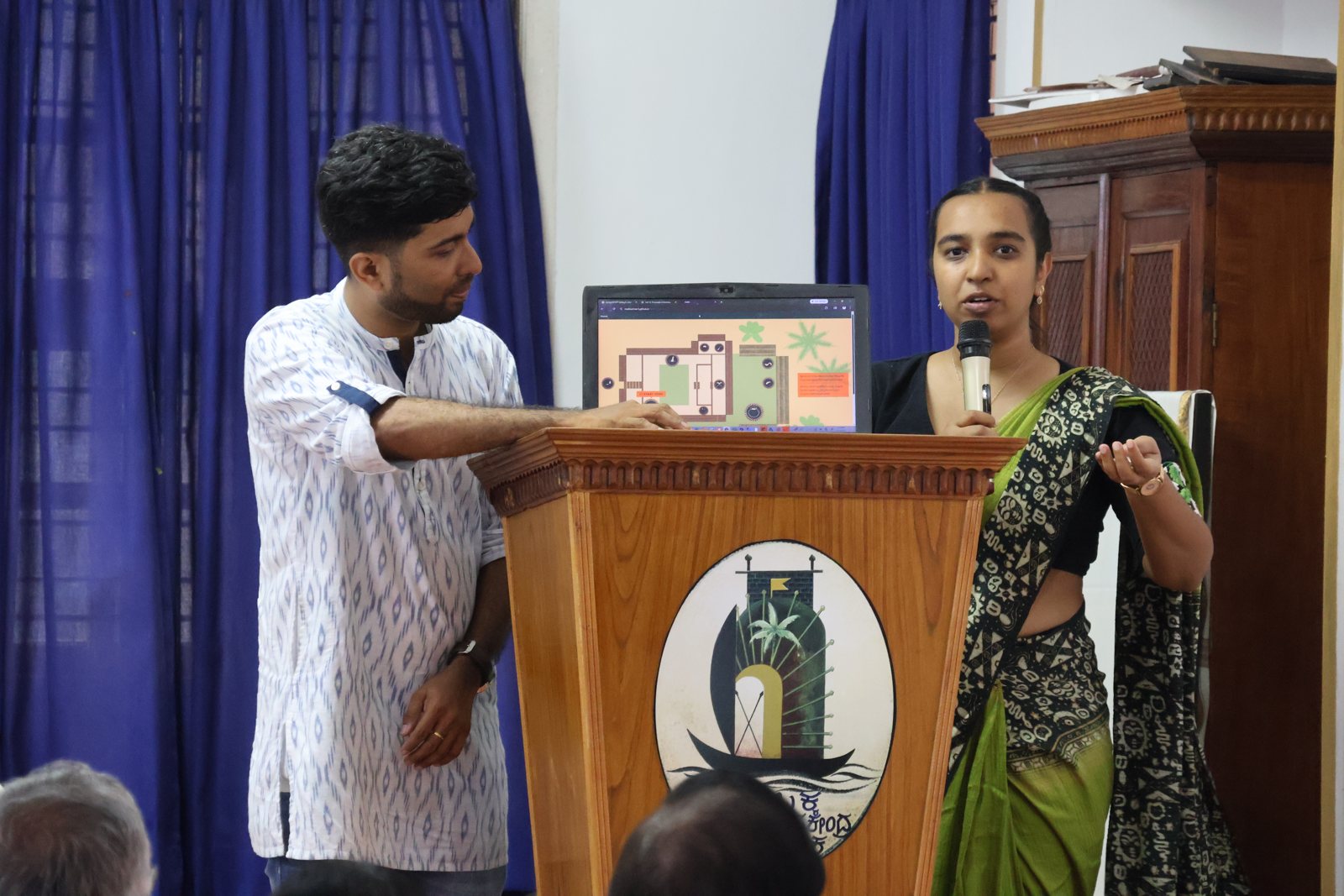 The curators speaking at the opening