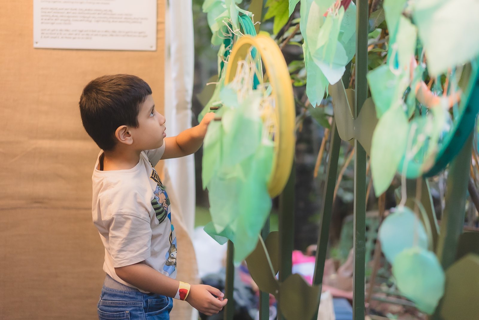 A child touching an artwork